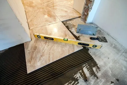 Custom tile and natural stone installation with precise cuts on a feature wall